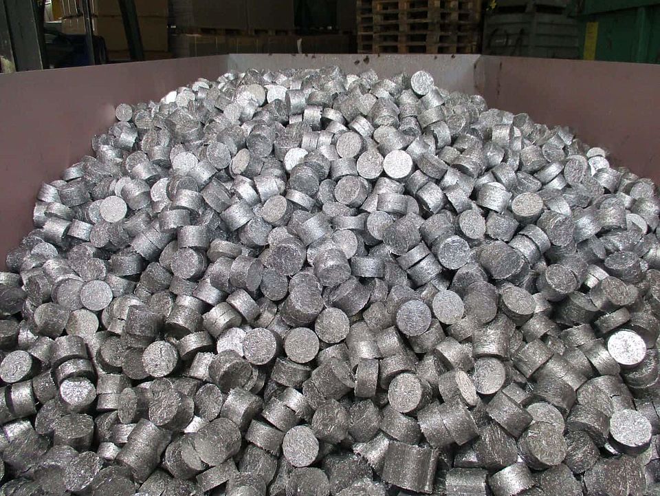 Aluminum briquettes in container